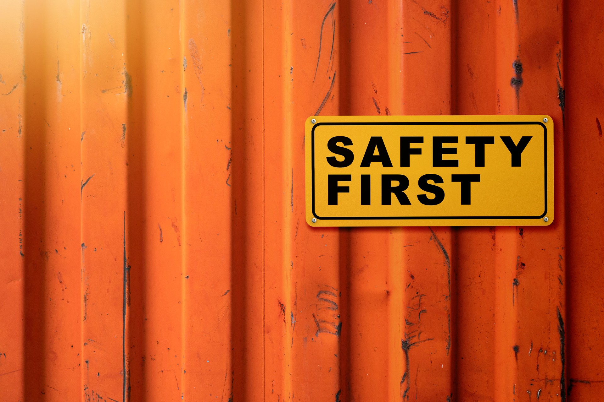 Yellow sign with 'safety first' text